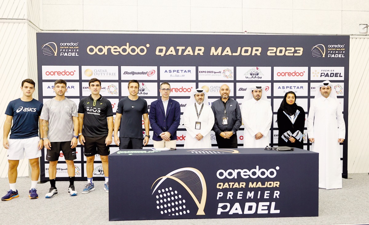 Players and officials pose for a group picture after the draw ceremony.