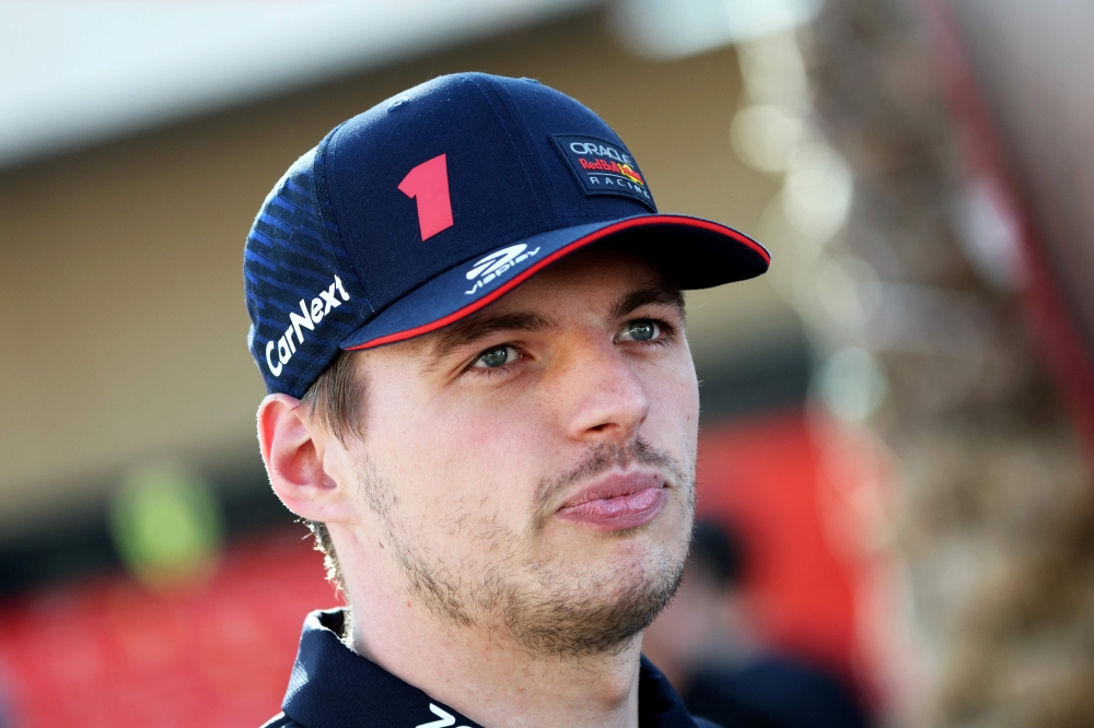 Red Bull Racing's Dutch driver Max Verstappen arrives in the paddock at the Bahrain International Circuit in Sakhir ahead of the Bahrain Formula One Grand Prix on March 2, 2023. (Photo by Giuseppe CACACE / AFP)