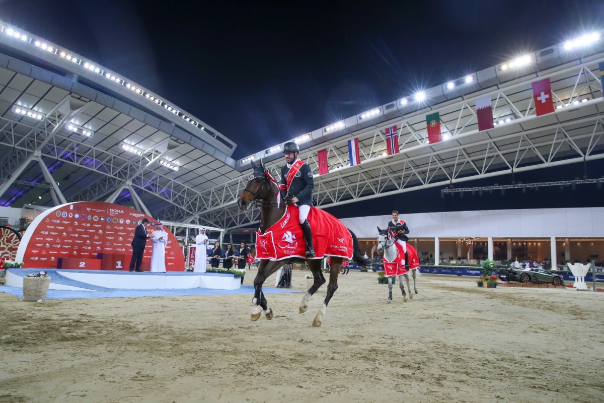 Riesenbeck International riders Christian Kukuk and Philipp Weishauppt celebrate after their win in the Global Champions League at the Longines Arena at Al Shaqab yesterday.