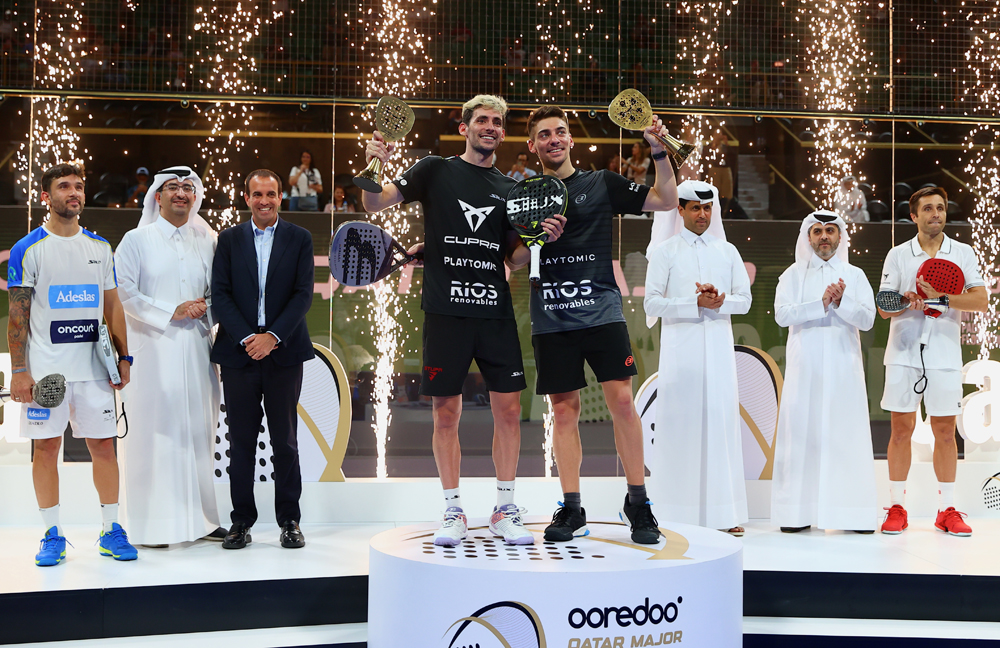 Argentina's Ooredoo Qatar Major champions Franco Stupackzuk and Martin Di Nenno celebrate with the trophies after defeating compatriots Fernando Belasteguin  and Carlos Daniel Gutierrez in the final yesterday. Qatar Tennis, Squash and Badminton Federation (QTSBF) President Nasser Ghanim Al Khelaifi, Ooredoo CEO Sheikh Ali bin Jabor Al Thani, FIP President Luigi Carraro and QTSBF Secretary General Tariq Zainal are also present.