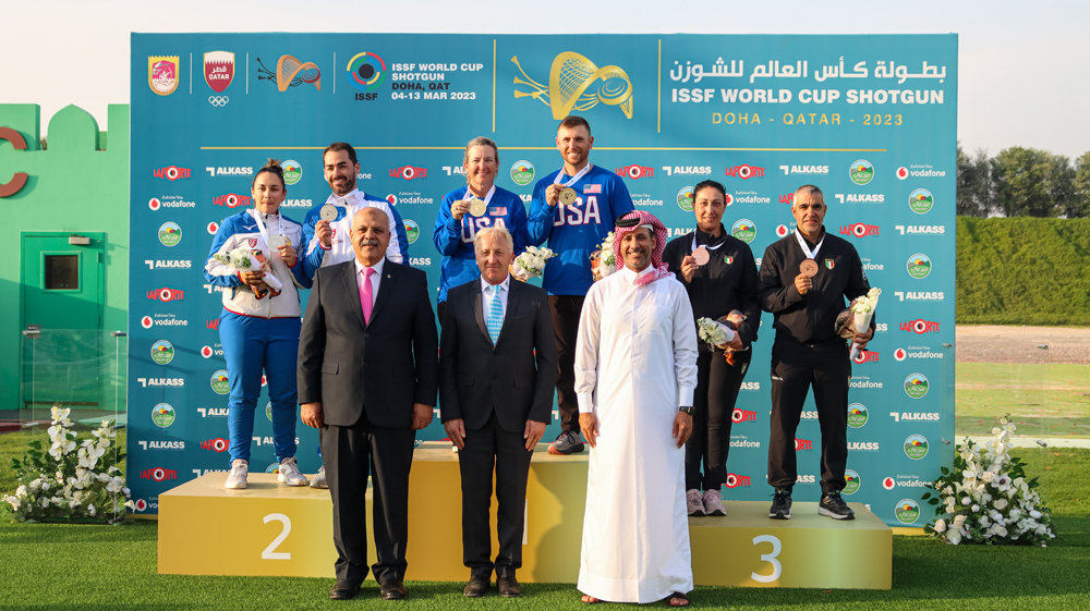 Qatar Shooting & Archery Association (QSAA) President Mishaal Ibrahim Al Nasr, International Shooting Sport Federation (ISSF) Secretary-General Willi Grill, and President of the African and Egyptian Shooting Federation Major General Hazem Hosny with the podium winners of the mixed team skeet event.