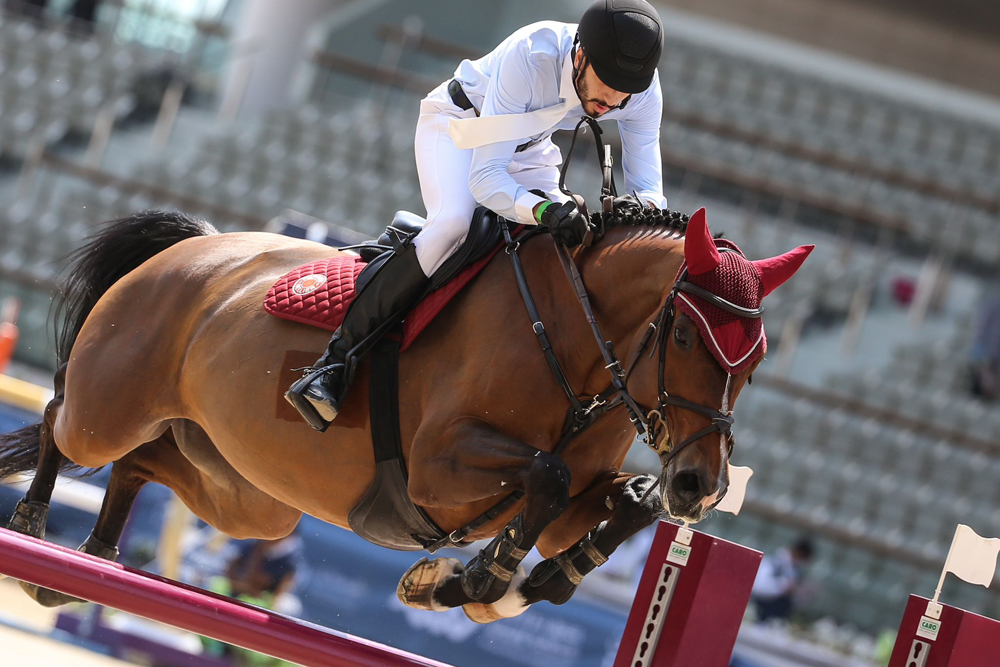 Mohammed Khalifa Al Baker guides What A Pleasure over an obstacle during the Open Class competition.