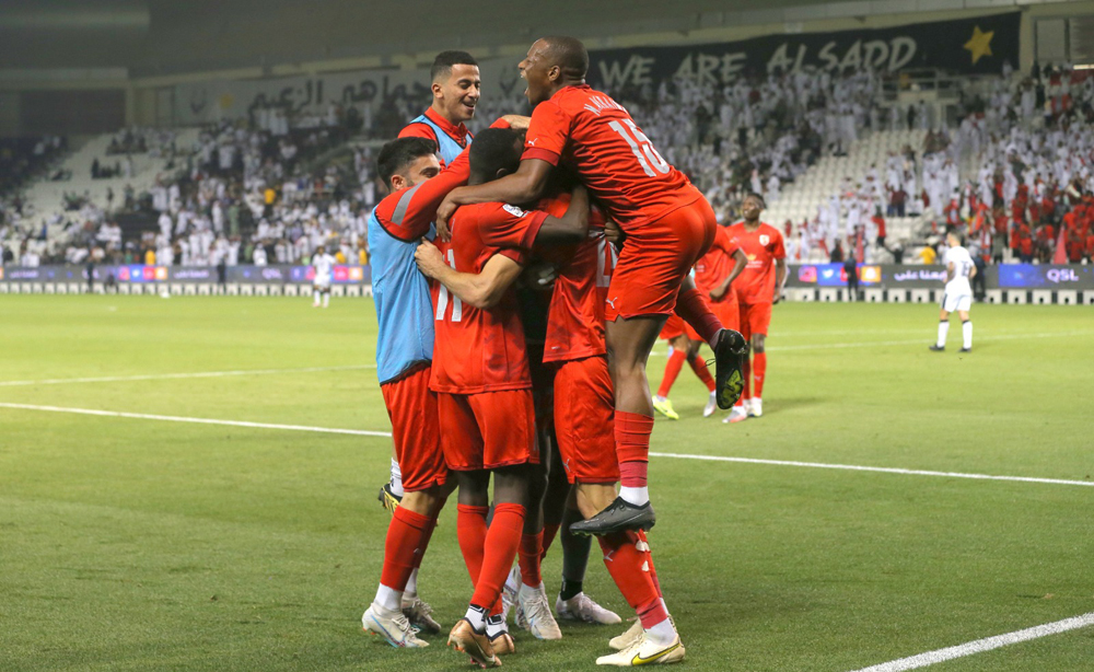 Al Duhail players celebrate after Federico Fernandez scored their second goal against Al Sadd.