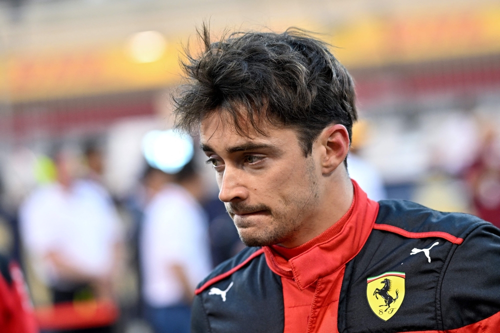 In this file photograph taken on March 5, 2023 Ferrari's Monegasque driver Charles Leclerc arrives on the racetrack before the Bahrain Formula One Grand Prix at the Bahrain International Circuit in Sakhir. Photo by ANDREJ ISAKOVIC / AFP