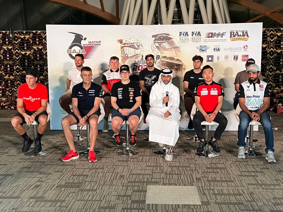 QMMF’s Executive Director Amro Al Hamad with drivers and riders during a press conference, yesterday.