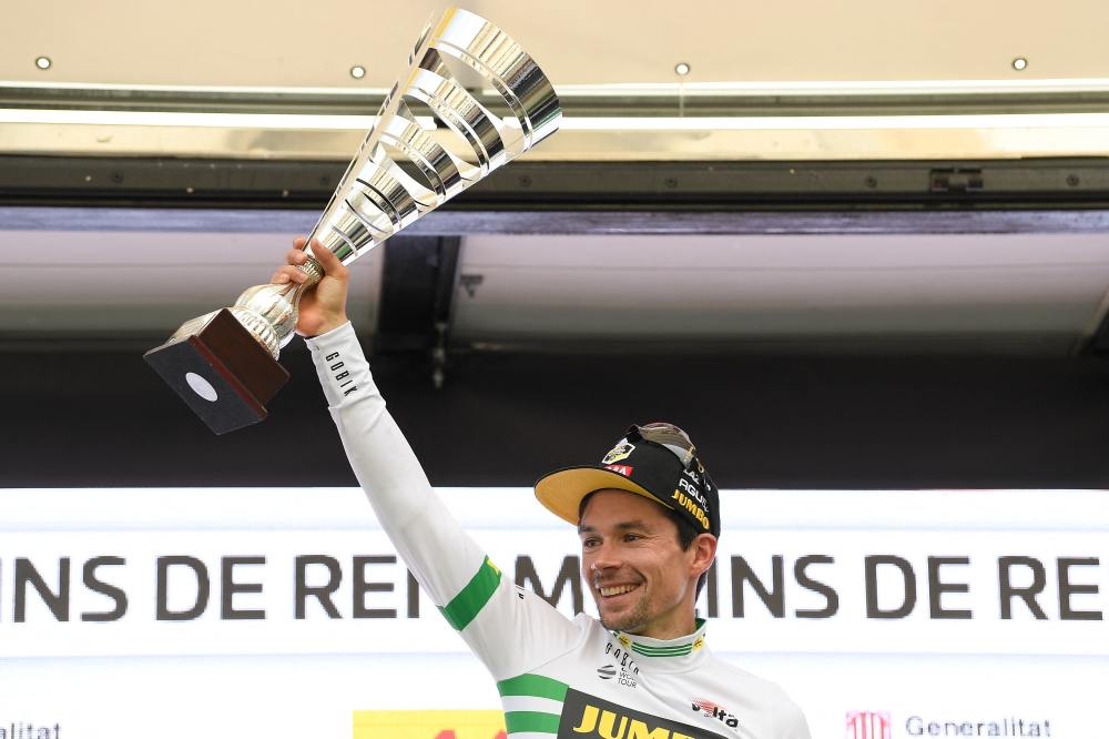 Overall leader Team Jumbo-Visma's Slovenian rider Primoz Roglic celebrates with the trophy on the podium after the 6th stage of the 2023 Volta Catalunya cycling tour of Catalonia, a 183 km race from Martorell to Molins de Rei, on March 25, 2023. Photo by Josep LAGO / AFP