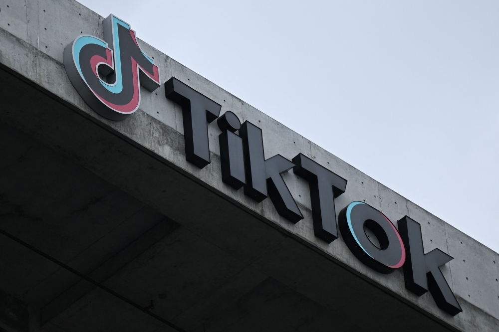 This file photo taken on March 16, 2023 shows the TikTok logo displayed outside the social media app's company offices in Culver City, California. Photo by Patrick T. Fallon / AFP