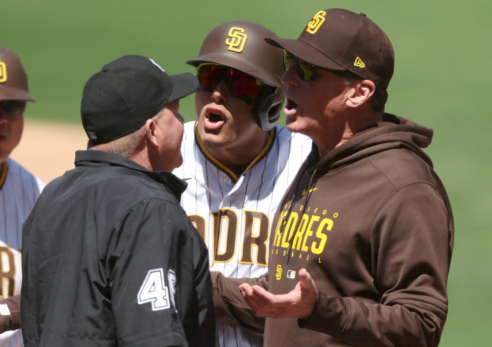 Head coach Bob Melvin argues with umpire Ron Kulpa #46 after Manny Machado #13 of the San Diego Padres was called out on a timed third strike during the first inning of a game against the Arizona Diamondbacks at PETCO Park on April 04, 2023 in San Diego, California. (Photo by Sean M. Haffey / GETTY IMAGES NORTH AMERICA / Getty Images via AFP)
