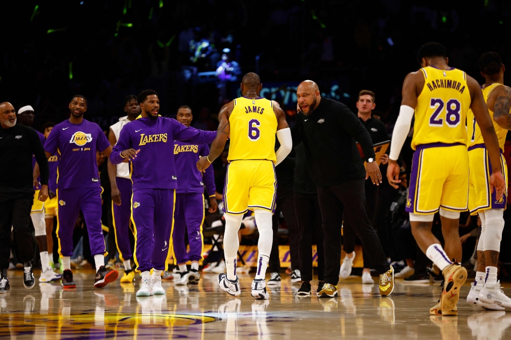 Head coach Darvin Ham and LeBron James #6 of the Los Angeles Lakers in the first half in Game Six of the Western Conference First Round Playoffs at Crypto.com Arena on April 28, 2023 in Los Angeles, California. (Photo by RONALD MARTINEZ / GETTY IMAGES NORTH AMERICA / Getty Images via AFP)
