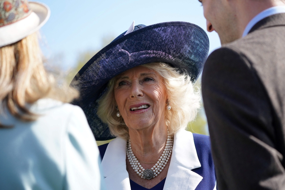 Britain's Camilla, Queen Consort meets guests during the Garden Party at Buckingham Palace, in London, on May 3, 2023 to celebrate her and her husband Britain's King Charles III coronation ceremony as King and Queen of the United Kingdom and Commonwealth Realm nations, on May 6, 2023. Photo by Yui Mok / POOL / AFP