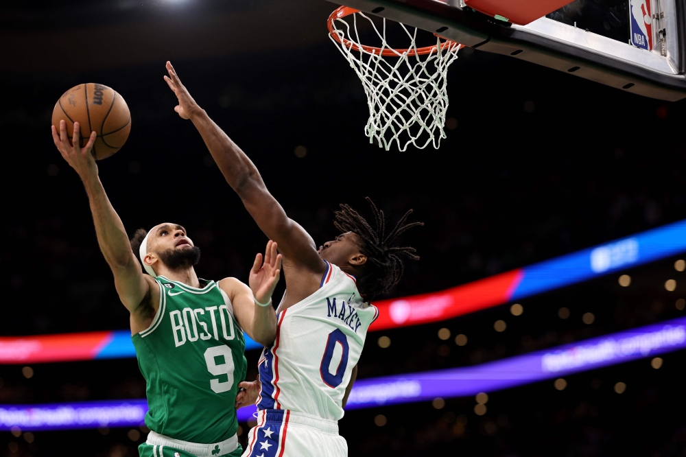 Derrick White #9 of the Boston Celtics takes a shot against Tyrese Maxey #0 of the Philadelphia 76ers during the second half of game two of the Eastern Conference Second Round Playoffs at TD Garden on May 03, 2023 in Boston, Massachusetts.  Maddie Meyer/Getty Images/AFP 