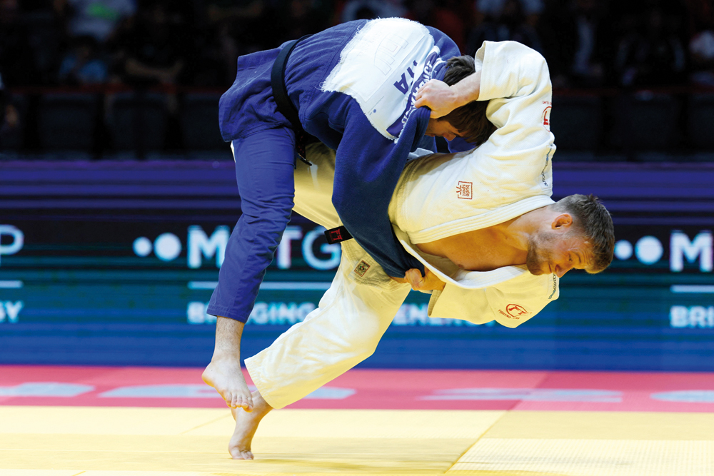 Switzerland’s Nils Stump (right) and Italy’s Manuel Lombardo compete in the men’s -73Kg final bout, yesterday. Pictures: AFP