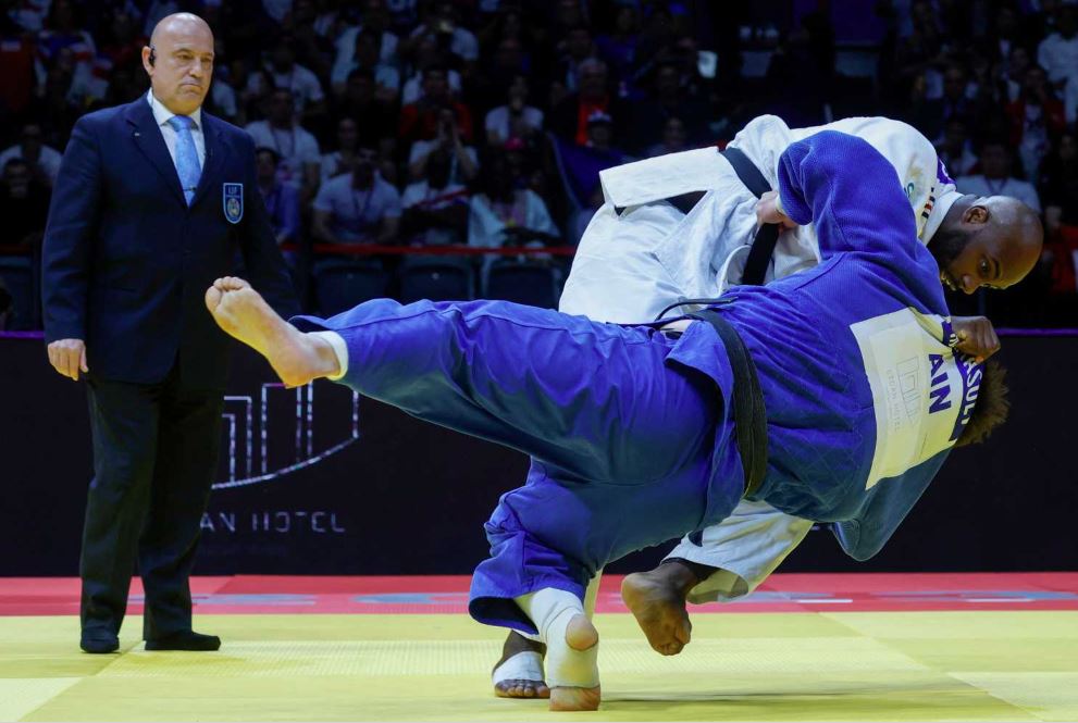 France’s Teddy Riner (white) and Russia’s Inal Tasoev in action during the men’s +100Kg final bout. AFP