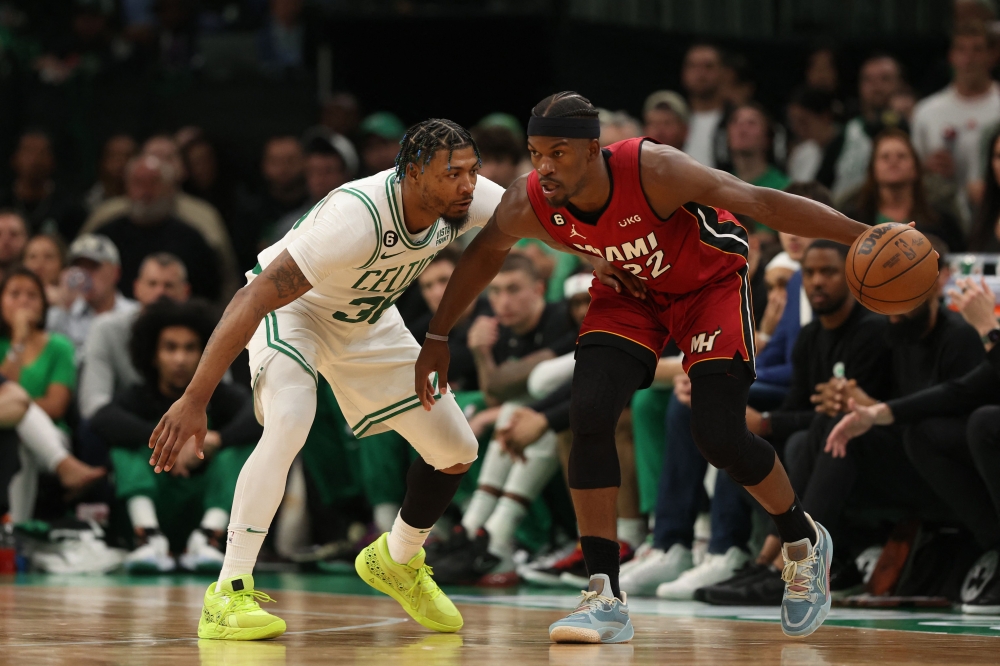 Jimmy Butler #22 of the Miami Heat is guarded by Marcus Smart #36 of the Boston Celtics during the fourth quarter in game two of the Eastern Conference Finals at TD Garden on May 19, 2023 in Boston, Massachusetts.  Adam Glanzman / AFP
