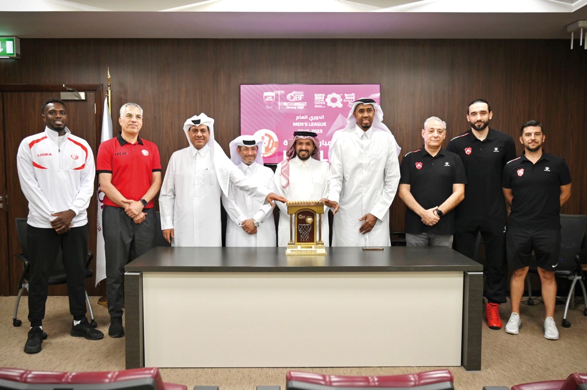 The officials of Qatar Basketball Association pose for a photograph with the coaches and captains of the Al Shamal and Al Rayyan teams after a press conference, yesterday.