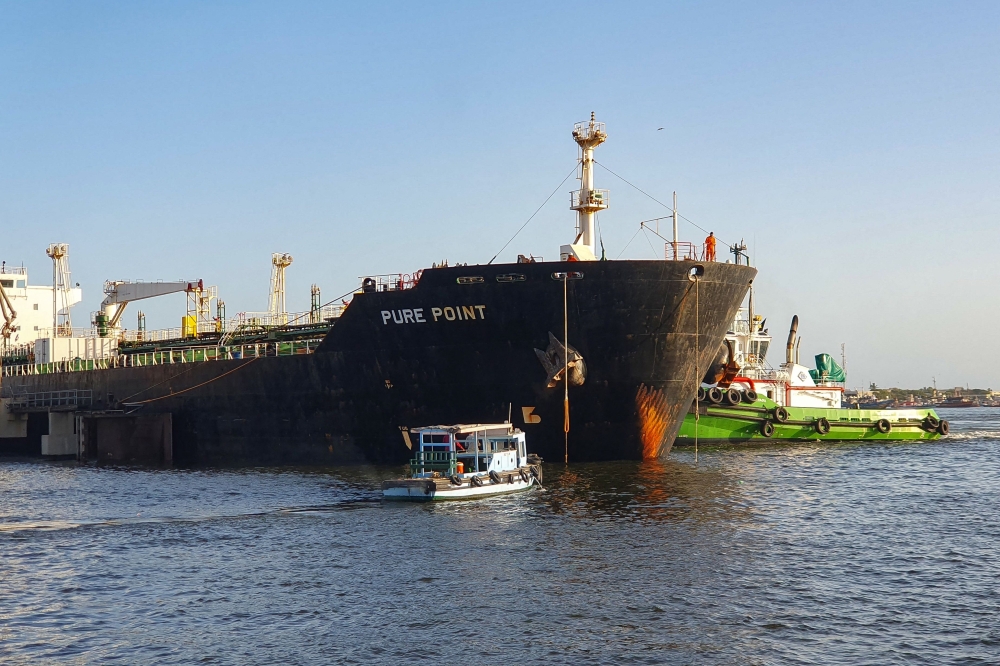 This handout photograph taken on June 11, 2023 and released by the Karachi Port Trust (KPT) shows a Russian cargo ship carrying crude oil at the port in Karachi. (Photo by Karachi Port Trust / AFP)