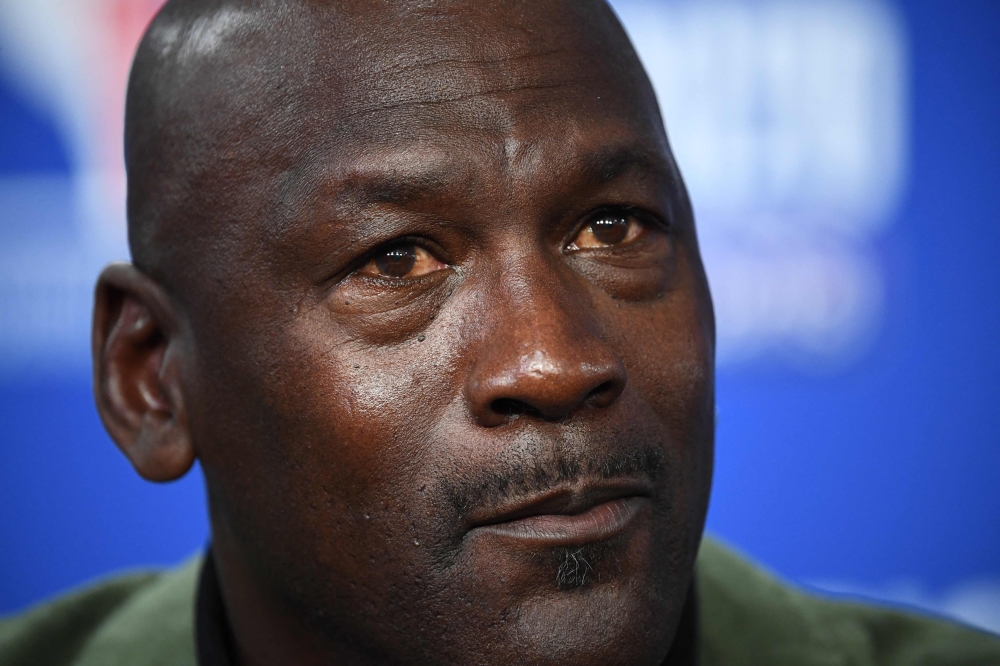 (FILES) Former NBA star and owner of Charlotte Hornets team Michael Jordan attends a press conference ahead of the NBA basketball match between Milwakuee Bucks and Charlotte Hornets at The AccorHotels Arena in Paris on January 24, 2020. (Photo by FRANCK FIFE / AFP)
