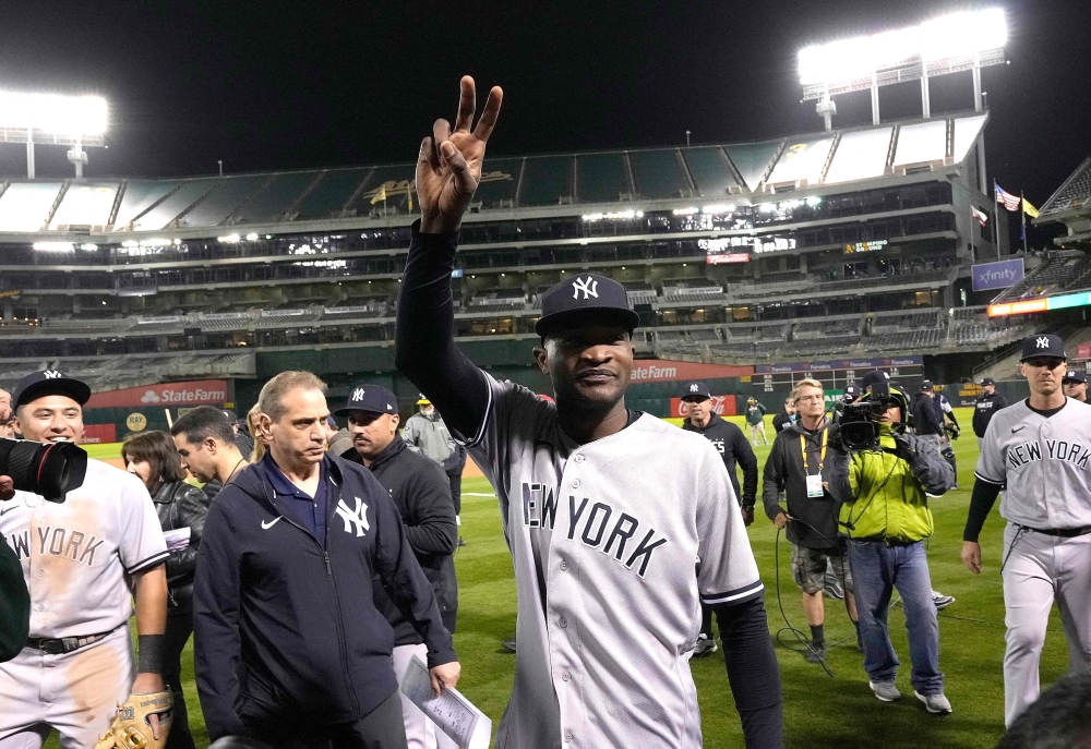 Domingo German #0 of the New York Yankees celebrates his no-hit perfect game against the Oakland Athletics, defeating them 11-0 at RingCentral Coliseum on June 28, 2023 in Oakland, California. (Photo by Thearon W. Henderson / GETTY IMAGES NORTH AMERICA / Getty Images via AFP)