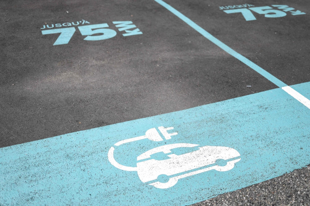 A photo shows markings for an electric car charging station in Toulouse, southwestern France, on July 17, 2023. (Photo by CHARLY TRIBALLEAU / AFP)