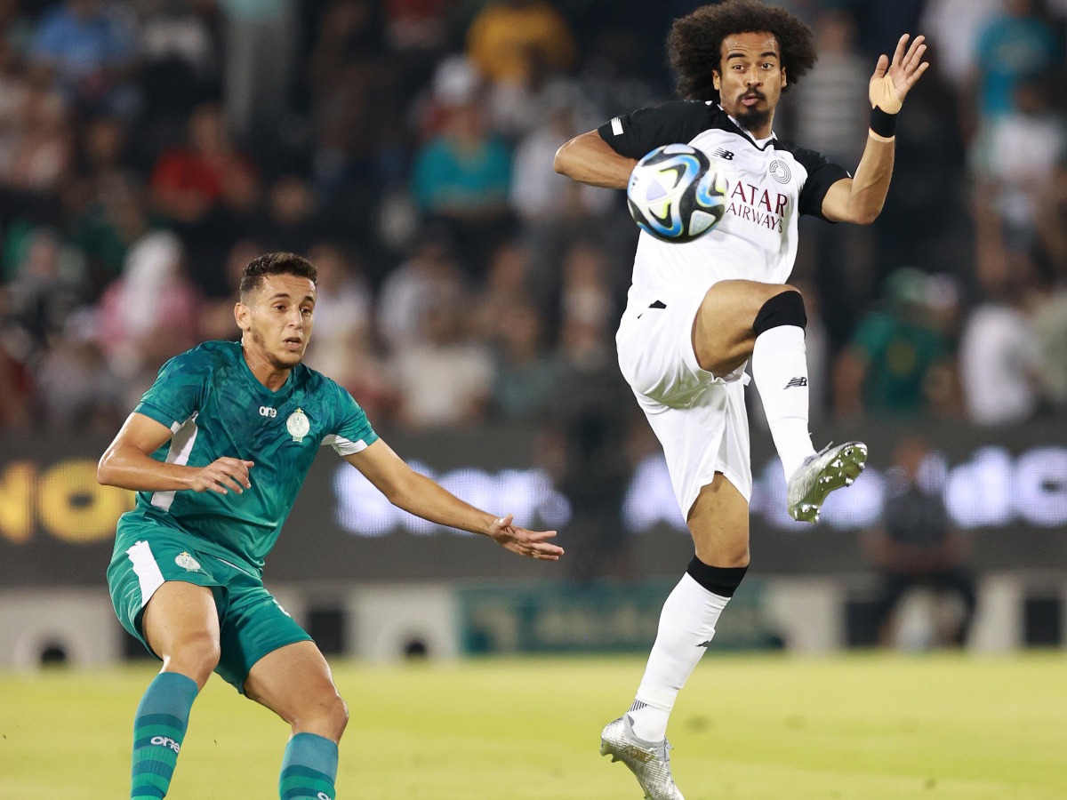 Al Sadd’s Akram Afif (right) in action during friendly against Raja Club Athletic yesterday. 