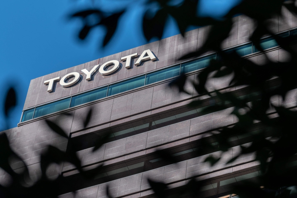 This picture taken on October 31, 2022 shows the logo of Toyota Motor being displayed atop the company's head office in Tokyo. Photo by Yuichi YAMAZAKI / AFP