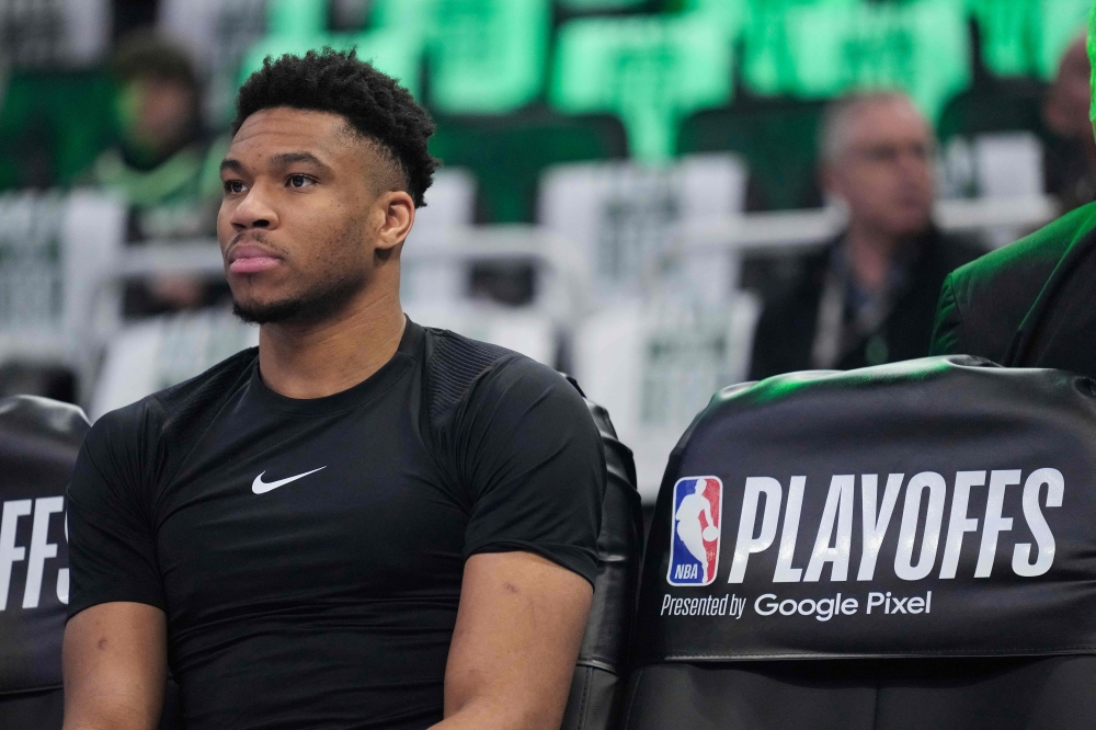 File photo: Giannis Antetokounmpo #34 of the Milwaukee Bucks sits on the bench before the start of Game One of the Eastern Conference First Round Playoffs against the Miami Heat at Fiserv Forum on April 19, 2023 in Milwaukee, Wisconsin. (Photo by Patrick McDermott / Getty Images via AFP)