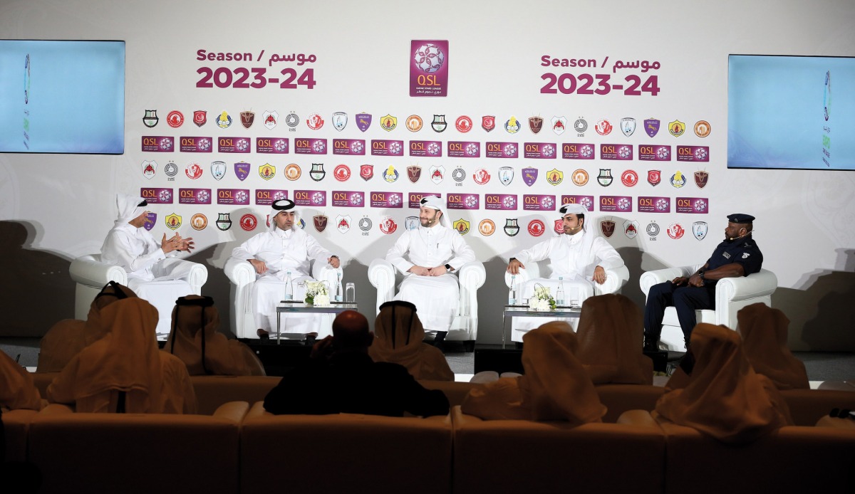 Qatar Stars League's Sales, Marketing and Communications Executive Director Hassan Rabiah Al Kuwari (second left), QSL Competitions and Football Development Executive Director Dr. Ahmed Khellil Abbassi (centre), Aspire Marketing and Communications Executive Director Nasser Abdullah Al Hajri (second right) and Captain Abdullah Masoud (right) from the Stadium Security Department of the Facilities and Authorities Security Department at the Ministry of Interior during a discussion at the launch. Pic: Mohamed Farag