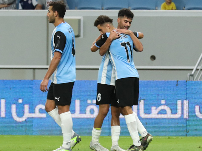 Al Wakrah's Ayoub Asal celebrates with teammates.