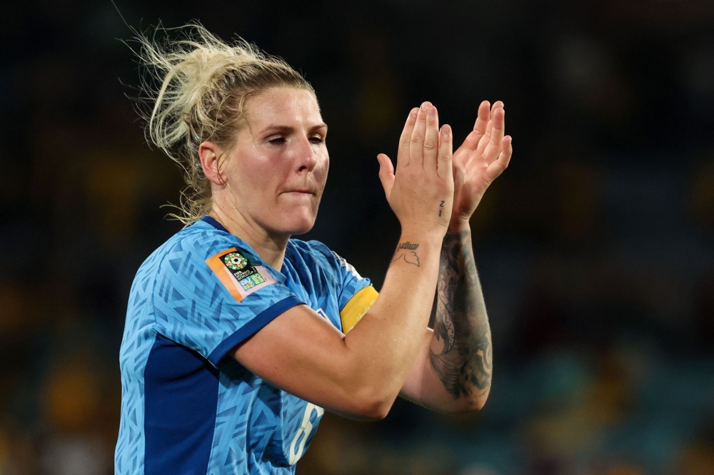 England's defender #06 Millie Bright celebrates their victory at Stadium Australia in Sydney on August 16, 2023. (Photo by Steve Christo / AFP)