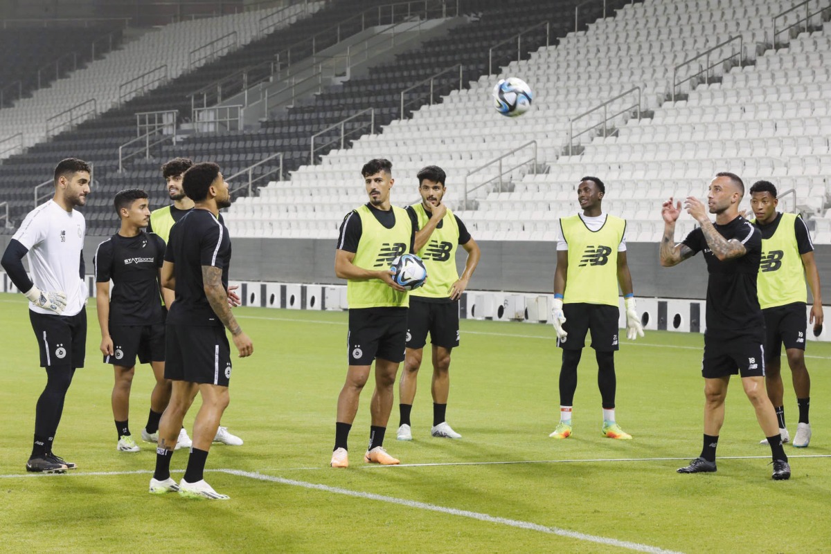 Al Sadd players in action during a training session.