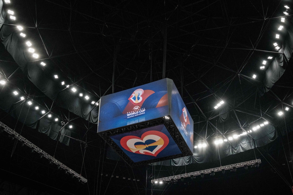 Screens show the logo of the FIBA Basketball World Cup during a training session at Indonesia Arena in Jakarta on August 24, 2023. (Photo by Yasuyoshi Chiba / AFP)