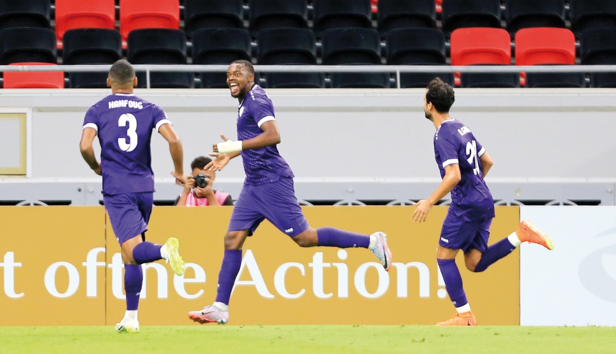  Guy Mbenza (centre) celebrates with teammates. Pic: Hussain Sayed 