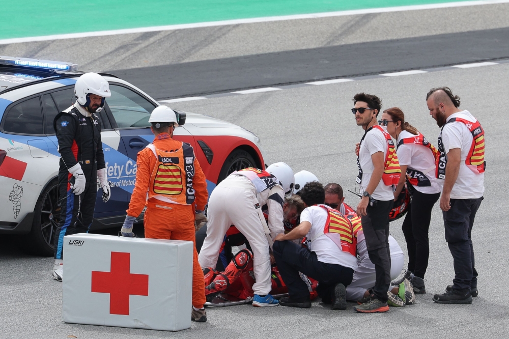 Ducati Italian rider Francesco Bagnaia receives medical assistance after a fall during the MotoGP race of the Moto Grand Prix de Catalunya at the Circuit de Catalunya in Montmelo, on the outskirts of Barcelona, on September 3, 2023. Photo by LLUIS GENE / AFP