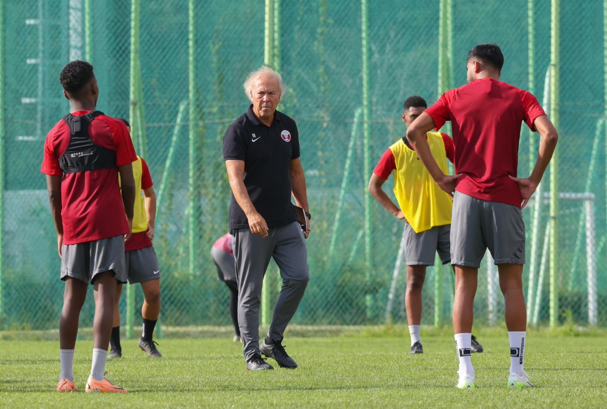 Qatar U-23 coach Ilidio Vale with players during a training session in Changwon, yesterday. 