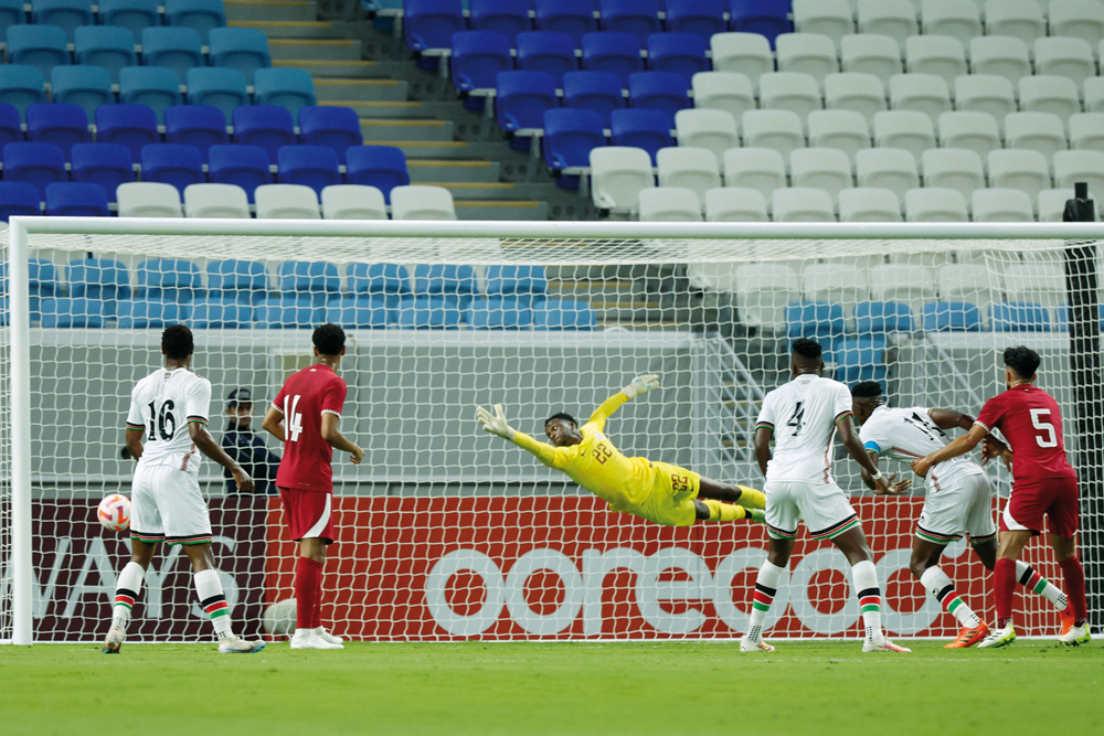 Qatar goalkeeper Meshaal Barsham concedes a goal against Kenya yesterday. AFP