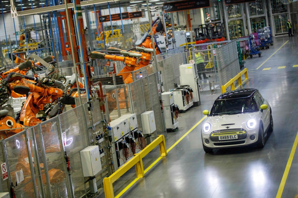 The new MINI electric car is unveiled at the BMW group plant in Cowley, near Oxford on July 9, 2019. Photo by Tolga Akmen / AFP