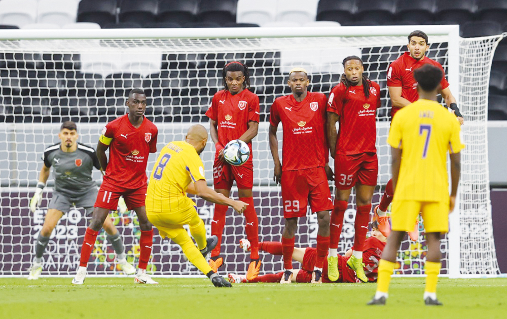 Yacine Brahimi shoots to score Al Gharafa's first goal against Al Duhail, yesterday.