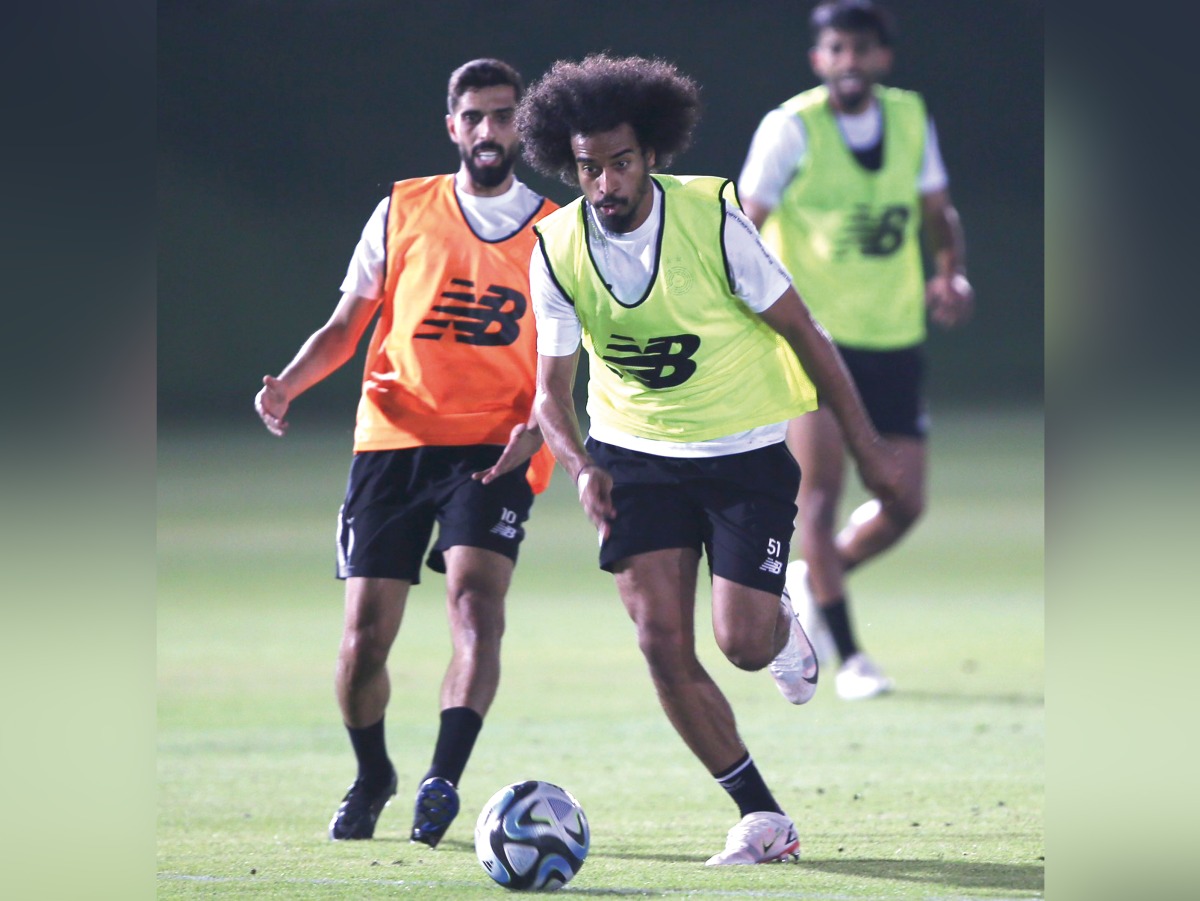 Al Sadd's Akram Afif (right) and Hassan Al Haydos in action during a training sessioan, yesterday.