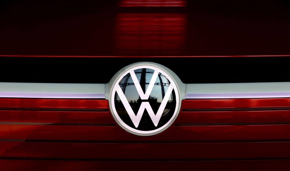 The VW logo is on display at the headquarters of German carmaker Volkswagen (VW) in Wolfsburg, northern Germany, on March 26, 2021. Photo by Ronny Hartmann / AFP