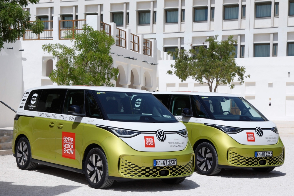 Volkswagen ID. Buzz vehicles are parked outside the venue hosting the Geneve International Motor Show (GIMS) in Doha on October 1, 2023, after crossing through 12 countries to arrive in Qatar from Geneva. Photos by KARIM JAAFAR / AFP