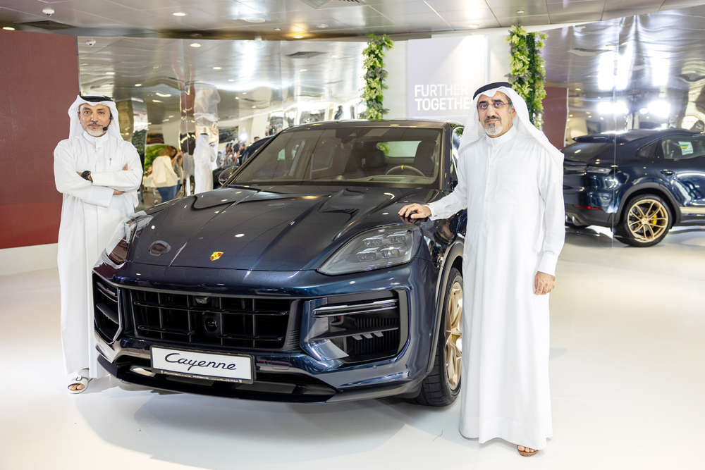 CEO of Porsche Centre Doha Salman Jassem Al Darwish (right) and Brand Manager of Porsche Centre Doha Ahed Dawood during the launch of new Cayenne in Doha. 