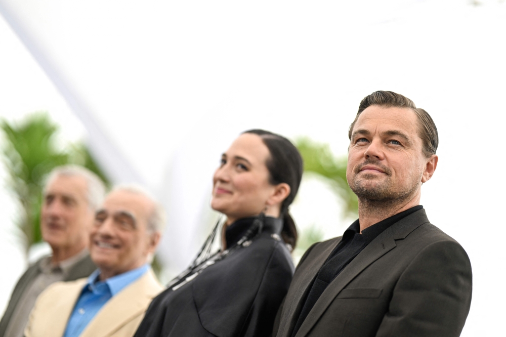 US actor Leonardo DiCaprio (R) poses with US actress Lily Gladstone (2ndR) during a photocall for the film 