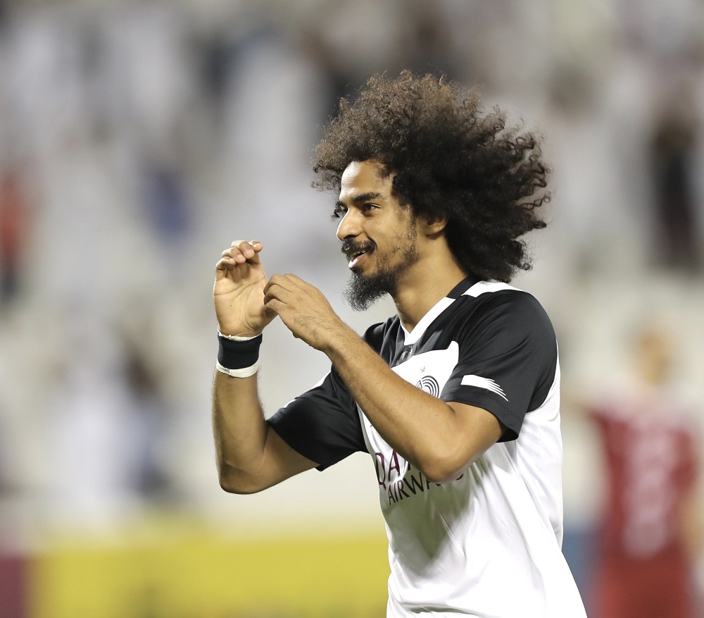 Al Sadd's Akram Afif celebrates after scoring a goal.