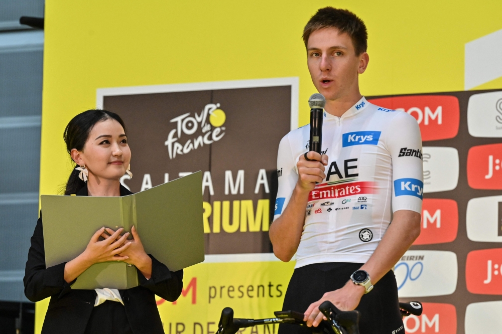 Tadej Pogacar of Slovenia (R) speaks to the crowd during an event a day ahead of the Tour de France Saitama Criterium cycling race in Saitama on November 5, 2023. Photo by Richard A. Brooks / AFP