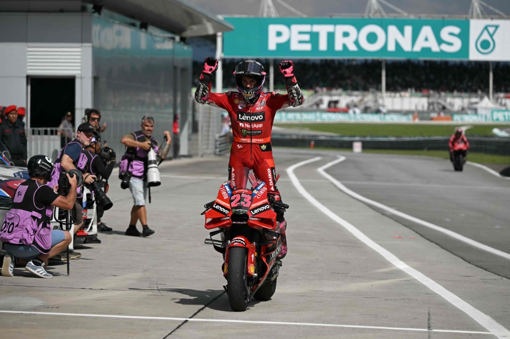 Winner Ducati Lenovo Team's Italian rider Enea Bastianini celebrates after the MotoGP Malaysian Grand Prix at the Sepang International Circuit in Sepang on November 12, 2023. Photo by MOHD RASFAN / AFP