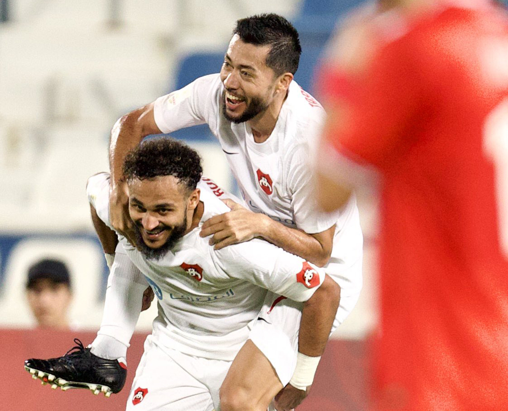 Al Rayyan's Rodrigo Tabata (right) celebrates with a teammate after scoring a goal against Al Shamal, yesterday.