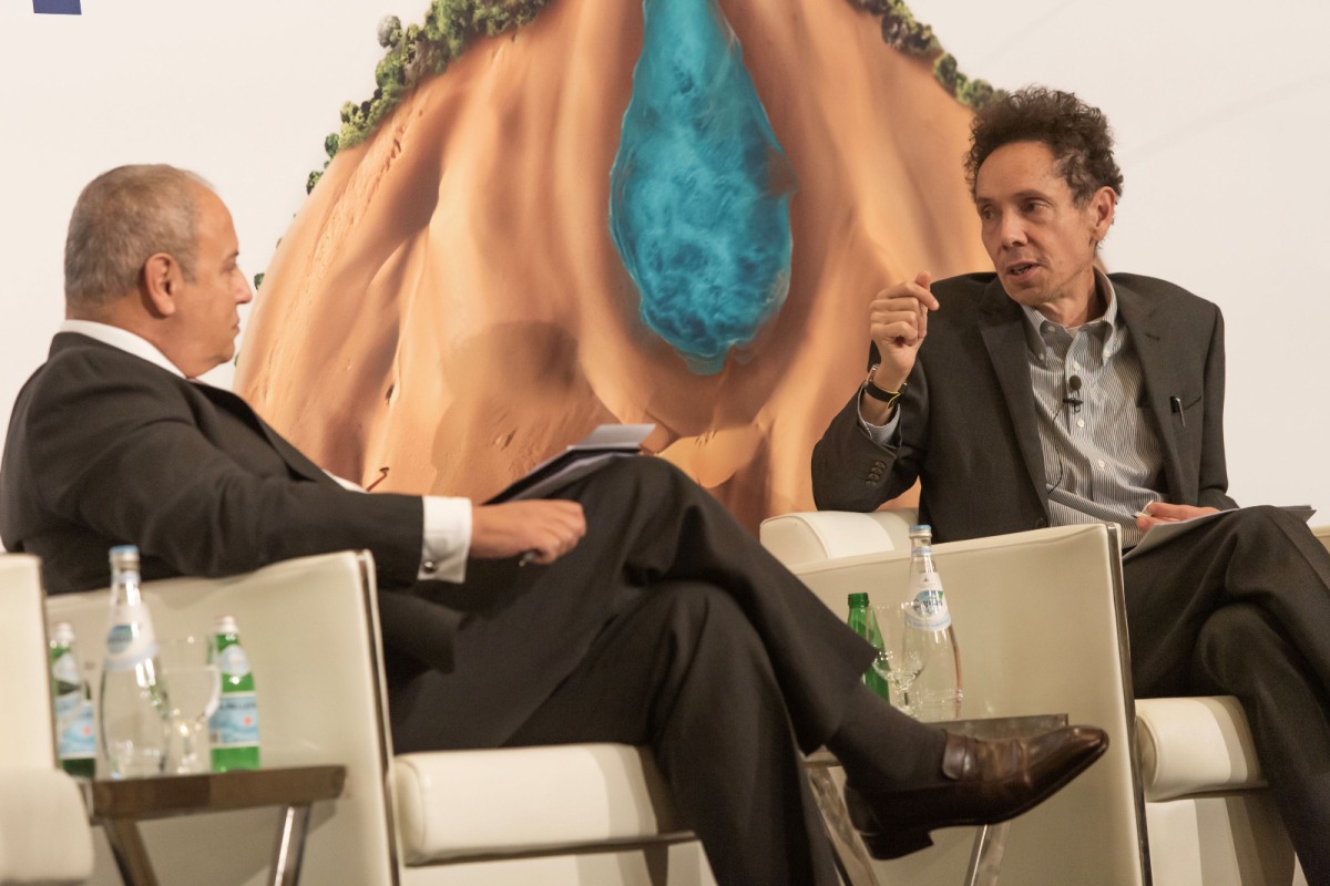 Dr. Safwan Masri (left), Dean of Georgetown University-Qatar and Keynote Speaker Malcolm Gladwell during the 'Sustaining the Oasis: Envisioning the Future of Water Security' conference on November 13, 2023.