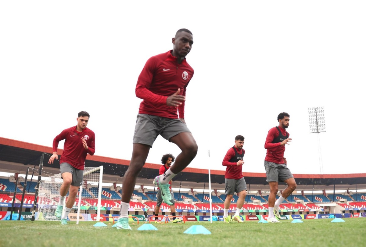 Qatar striker Almoez Ali (foreground) along with teammates takes part in team's training session in Bhubaneswar on Tuesday.