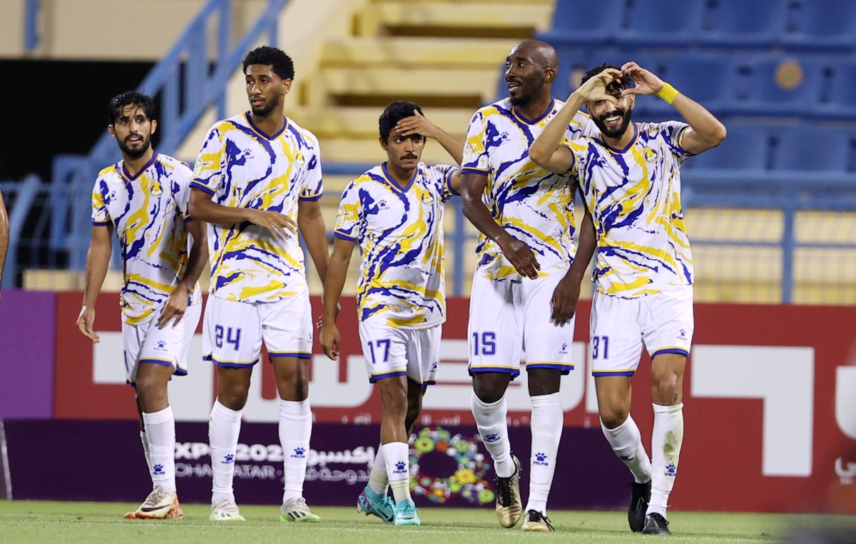 Ferjani Sassi (right) celebrates after scoring Al Gharafa's  winning goal against Umm Salal in Round 9.