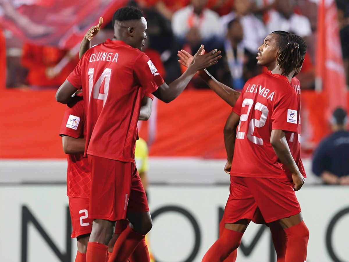 Al Duhail's Michael Olunga (left) celebrates with teammates on Monday.